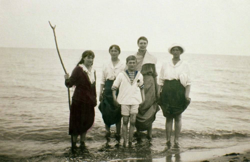 Grand Duchesses Olga, Maria and Anastasia and Tsarevich Alexei with the Romanov family friend, "Ritka" Khitrovo. 