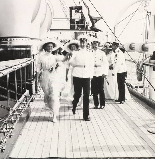 Grand Duchess Olga Nikolaevna dancing with an officer aboard imperial yacht. 