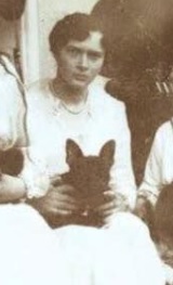 Grand Duchess Tatiana and her little French bulldog Ortipo, given to her by her favorite office Dmitri Malama.