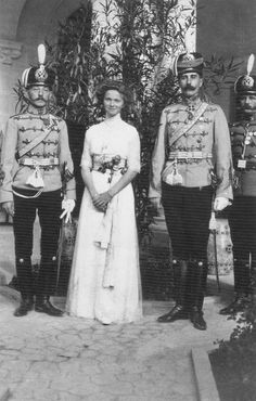 Sixteen year old Olga Romanova posing with officers of her regiment. 
