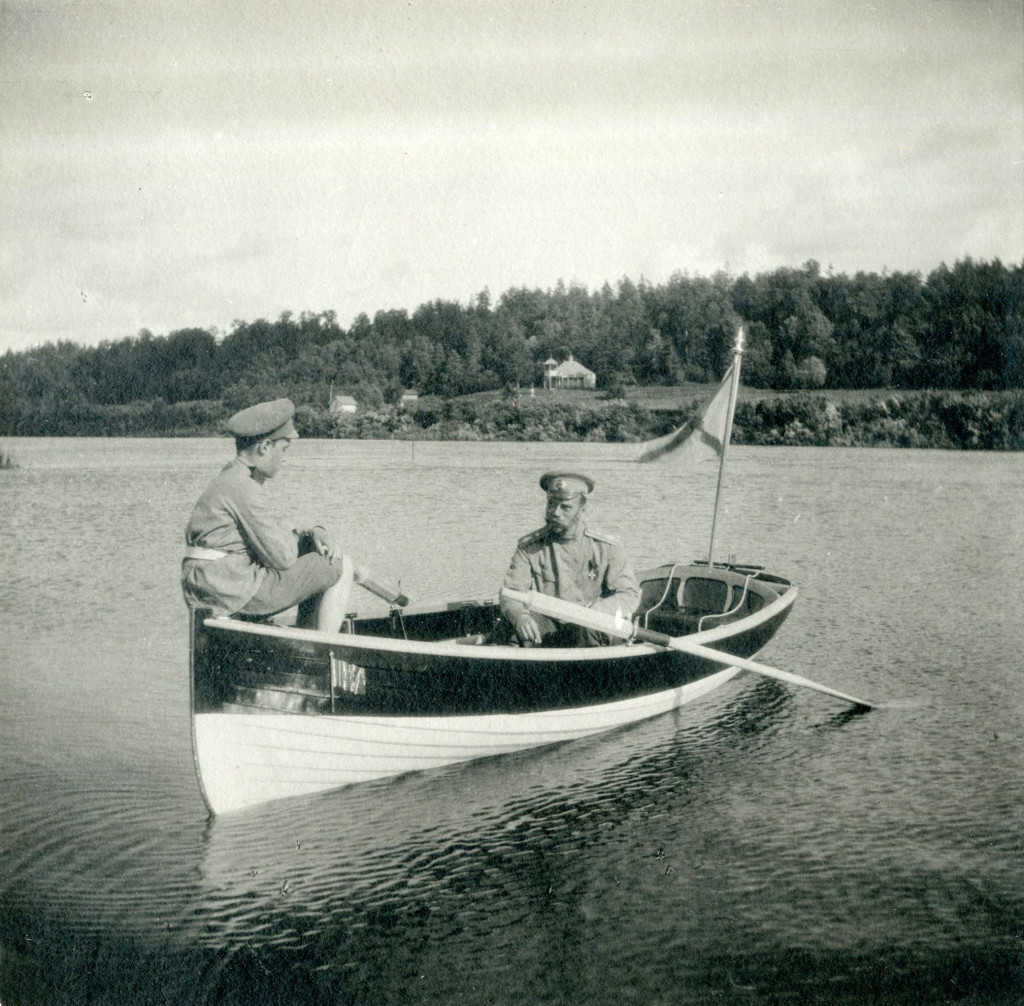 Tsar Nicholas II and his son Tsarevich Alexei rowing a boat on the Dnepr River. 