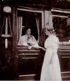 Empress Alexandra, and Tsarevich Alexei inside the Romanov family train with Grand Duchess Olga looking in. 