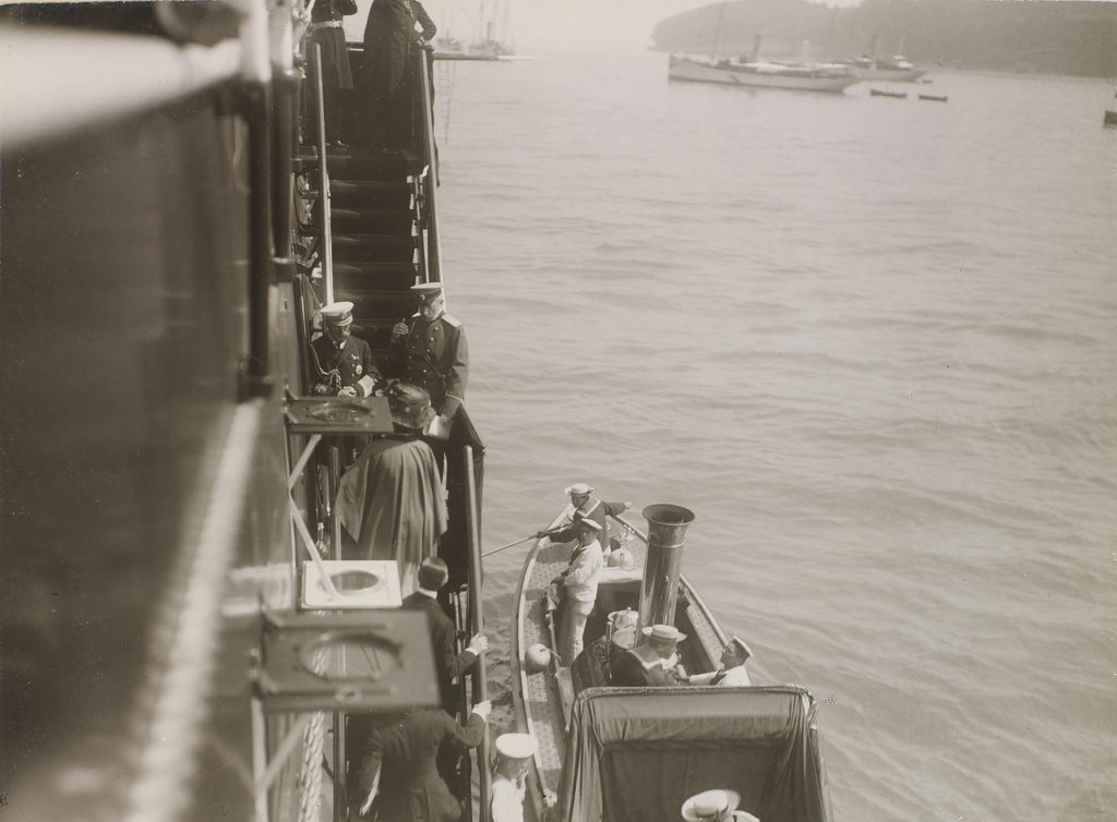 The British royal family and suite arriving on The Standart to visit the Romanov family. 