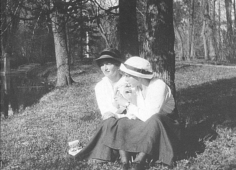Grand Duchess Olga and Grand Duchess Anastasia smoking in the garden