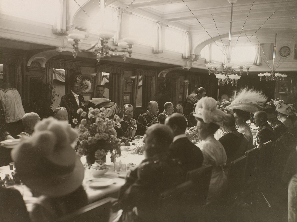 The Romanov family dining with their British royal cousins on The Standart 