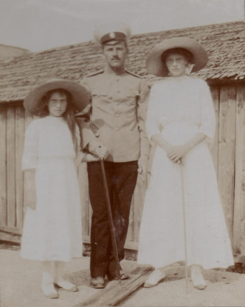 Grand Duchess Anastasia and Grand Duchess Tatiana with an officer. Photo credit: ГА РФ, ф. 651 оп. 1 д. 265 л. 4 об. фото 27