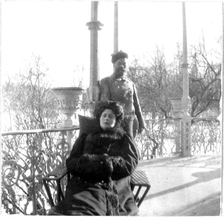 Tsar Nicholas II and Empress Alexandra in her wheelchair on the Alexander Palace balcony