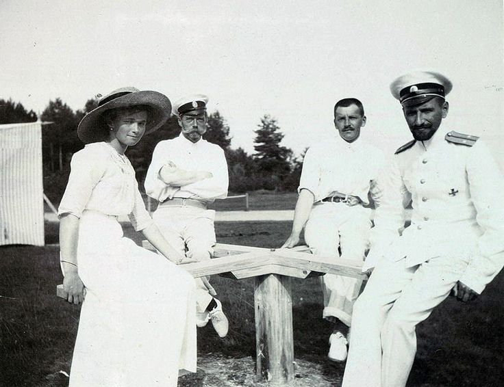 Grand Duchess Olga with Pavel Voronov, with Nicholas II and another officer in background. 