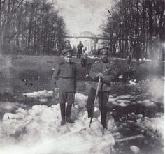 Nicholas II and Alexei breaking ice on one of the canals at Tsaskoe Selo. 