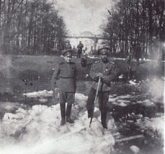 Nicholas II and Alexei breaking ice on one of the canals at Tsaskoe Selo.