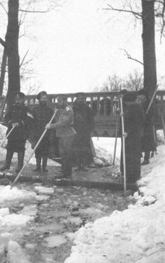 Romanov family loved snow. Here they breaking the ice on one of the canals