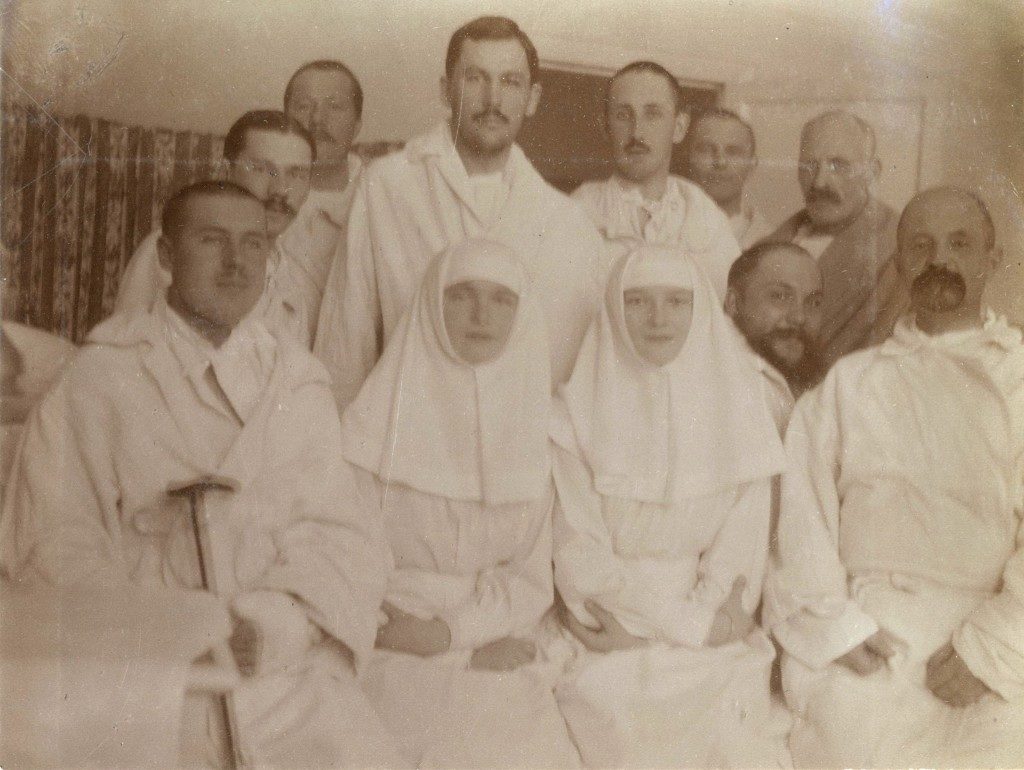 Sister Olga Romanov and Sister Tatiana Romanov with the wounded at their infirmary. 