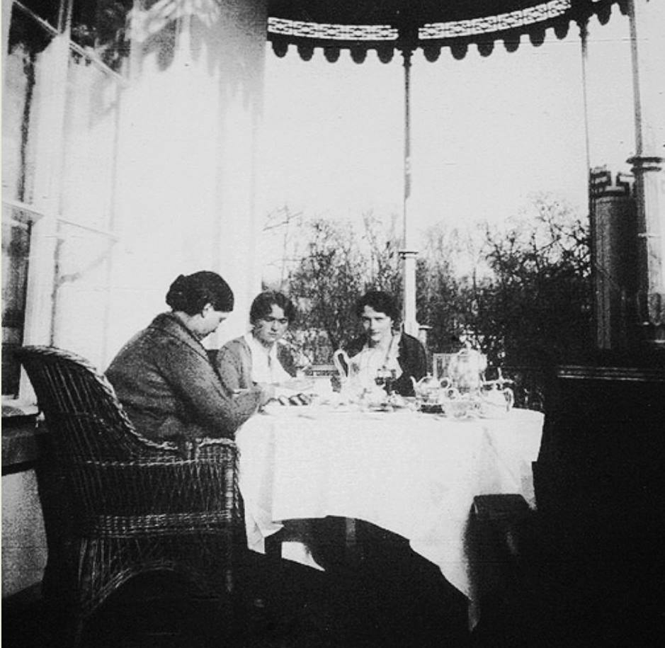 Tatiana Romanov with her sisters Olga and Maria on the balcony having tea. Summer 1914. 